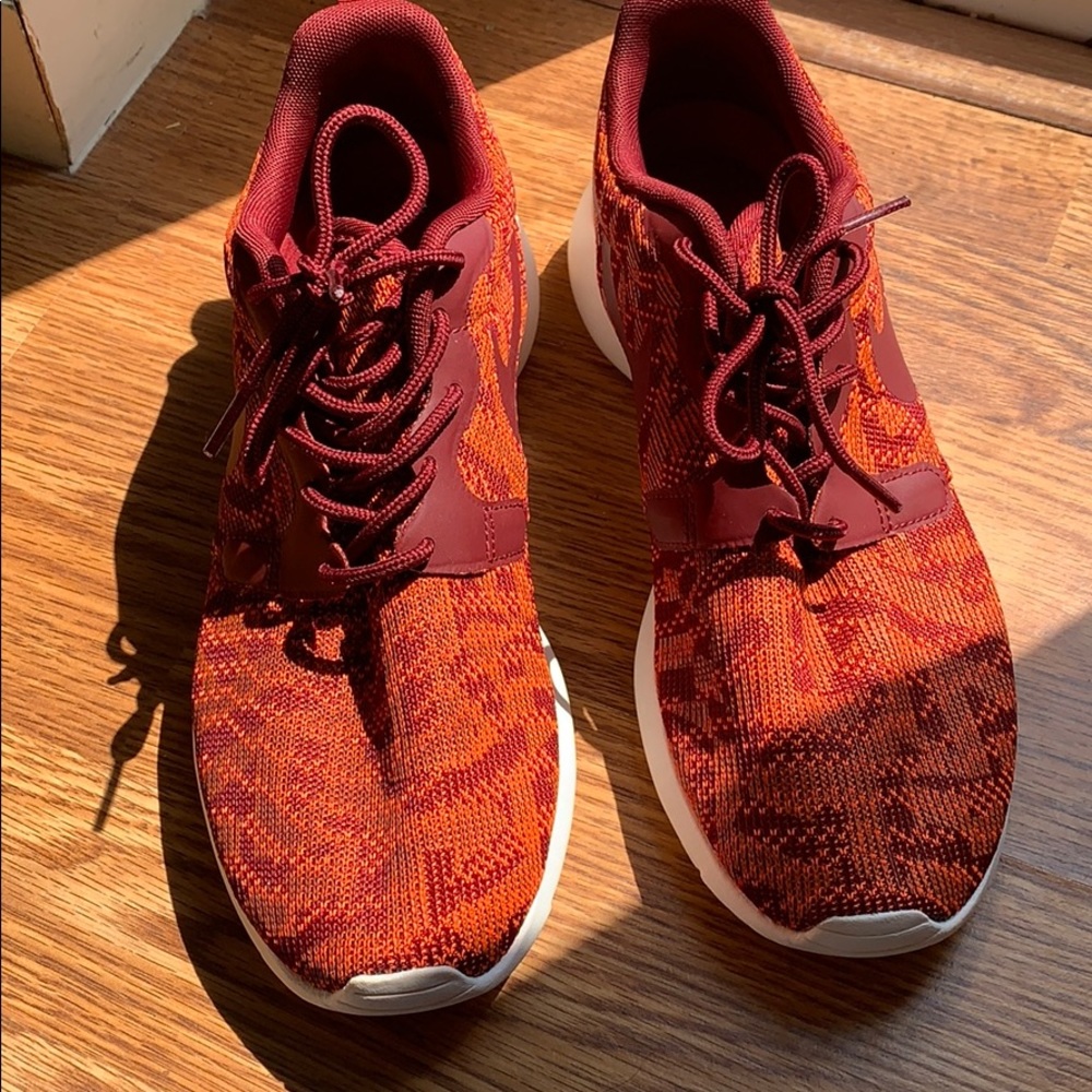 Nike red/orange Aztec sneakers.